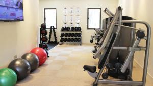 a room with a gym with exercise equipment at Villa Esmeralda in Rio Grande