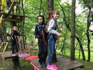 two children on a zip line in a park at Activ Parc in Negreşti