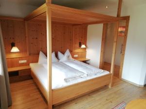Postel nebo postele na pokoji v ubytování Tirol Appartement Haus Zillertal
