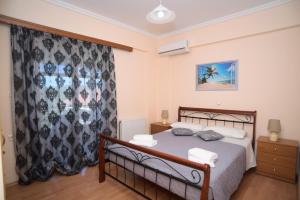 a bedroom with a bed in a room at Villa Irini Ammousa in Ágios Nikólaos