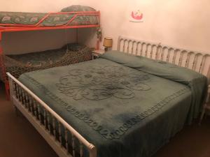 A bed or beds in a room at Borno, Appartamento nel centro del paese