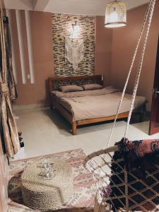 Postel nebo postele na pokoji v ubytování Cactus Homestay