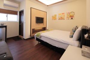 Katil atau katil-katil dalam bilik di Happiness Yes Hostel 3