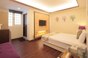 Ένα ή περισσότερα κρεβάτια σε δωμάτιο στο Happiness Yes Hostel 3