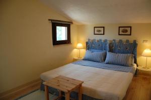 Postel nebo postele na pokoji v ubytování Agriturismo SPA Serpanera + 37 fotografií