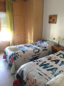 A bed or beds in a room at Casa Rural González Montsec Montrebei