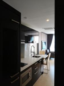 a kitchen with a sink and a counter top at Centara Avenue apartment 711 in Pattaya