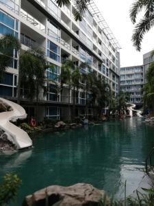 a river in front of a large apartment building at Centara Avenue apartment 711 in Pattaya
