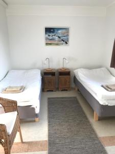 Postel nebo postele na pokoji v ubytování Hillesgården