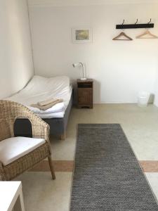 Postel nebo postele na pokoji v ubytování Hillesgården