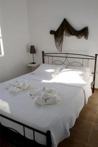Un ou plusieurs lits dans un hébergement de l'établissement Ariadne,traditional apartment in centre of Poros