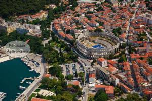 an aerial view of a city with a stadium at Parkside Apartments in Pula