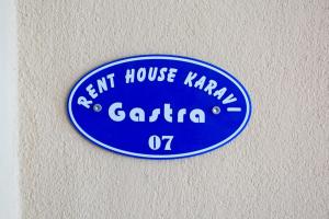 a blue sign that says ant house karavan gaato at Rent House Karavi in Iraklitsa