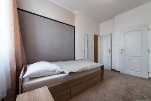 Postel nebo postele na pokoji v ubytování Penzion Homér Slaný