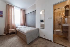 Postel nebo postele na pokoji v ubytování Penzion Homér Slaný