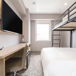 Postel nebo postele na pokoji v ubytování Super Hotel Shonan Fujisawaeki Minamiguchi
