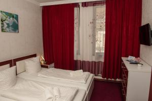 Voodi või voodid majutusasutuse Guest House VIP toas