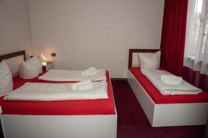 Voodi või voodid majutusasutuse Guest House VIP toas