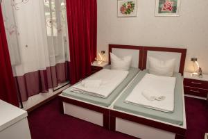 Voodi või voodid majutusasutuse Guest House VIP toas