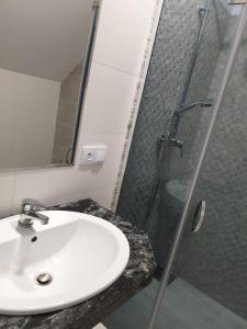 A bathroom at Apartamenty Zełwągi