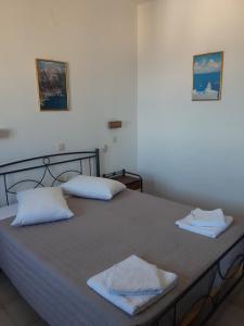 Postel nebo postele na pokoji v ubytování Villa Firostefani + 37 fotografií