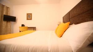Ein Bett oder Betten in einem Zimmer der Unterkunft ILLIYIN Boutique Hotel
