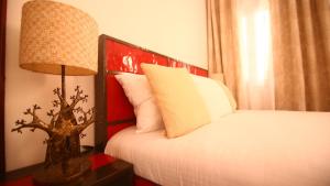 Ein Bett oder Betten in einem Zimmer der Unterkunft ILLIYIN Boutique Hotel