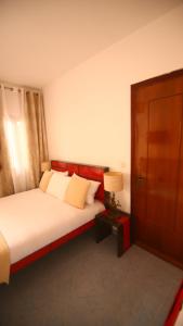 Ein Bett oder Betten in einem Zimmer der Unterkunft ILLIYIN Boutique Hotel