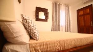 Ein Bett oder Betten in einem Zimmer der Unterkunft ILLIYIN Boutique Hotel