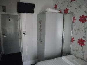 Postelja oz. postelje v sobi nastanitve The Withnell Hotel