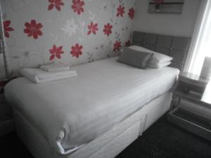 Postelja oz. postelje v sobi nastanitve The Withnell Hotel