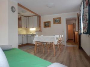 a kitchen and dining room with a table and chairs at Haus Machreich in Bad Gastein