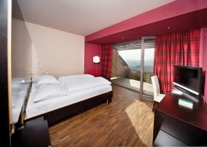 Posteľ alebo postele v izbe v ubytovaní Weingartenhotel Harkamp Südsteiermark