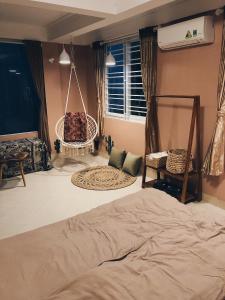 Postel nebo postele na pokoji v ubytování Cactus Homestay