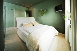 Posteľ alebo postele v izbe v ubytovaní Weingartenhotel Harkamp Südsteiermark