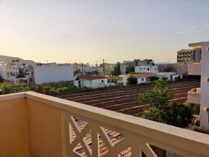 a view of a city from a balcony at Katerina Apartments in Stalís +19 photos