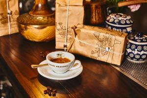a cup of coffee on a table next to a bag at IL VIAGGIATORE VIA PIAVE in Gaeta