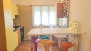 a kitchen with a counter and stools in it at Your Way in Venice in Mestre