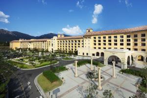 a large building with a courtyard in front of it at Hanwha Resort Seorak Sorano in Sokcho