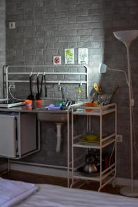 a kitchen with a sink and a counter with dishes at White House Sarajevo in Sarajevo +4 photos