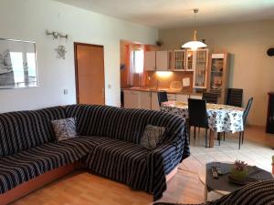 a living room with a couch and a table at Apartment Ruža in Betina