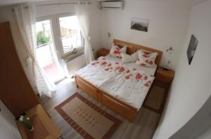 Postel nebo postele na pokoji v ubytování Ferienwohnungen und Appartements - Haus Budinger