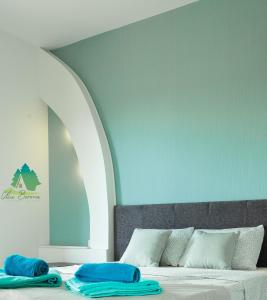 a bedroom with a bed with two towels on it at Apartmani borova 2 in Veliko Gradište +94 photos