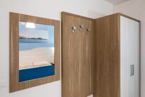 a bathroom with a medicine cabinet with a mirror at La Duchessa e Il Contadino in Vieste