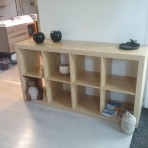 a wooden book shelf with a teddy bear in it at B&B Le verger in Échillais