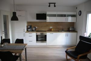 Kuchyň nebo kuchyňský kout v ubytování Ferienwohnungen und Appartements - Haus Budinger