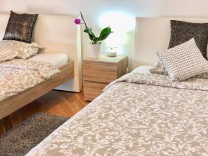 Postel nebo postele na pokoji v ubytování Apartments Corina