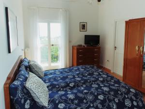 Postel nebo postele na pokoji v ubytování Il Gelso