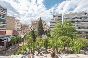 a view of a city with tall buildings at Zenios Kisamos-Pretty comfy studio in Athens