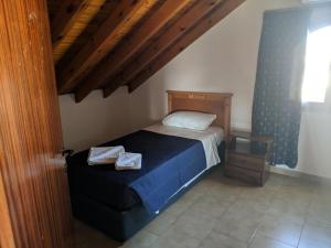 Postel nebo postele na pokoji v ubytování Tondoris Apartments